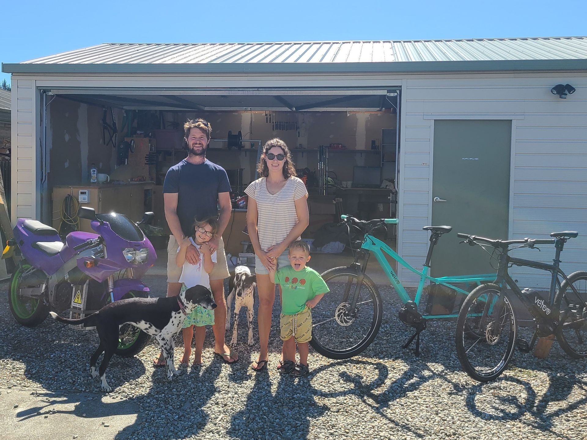 Family in front of the Veto workshop in Alexandra, New Zealand Family in front of the Veto workshop in Alexandra, New Zealand